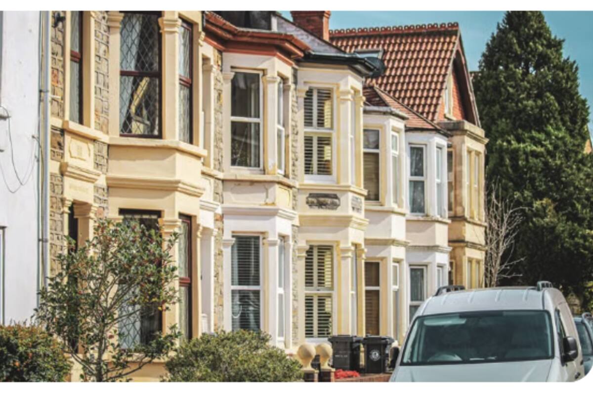 Victorian bay-windowed terraced houses on a sunny UK street