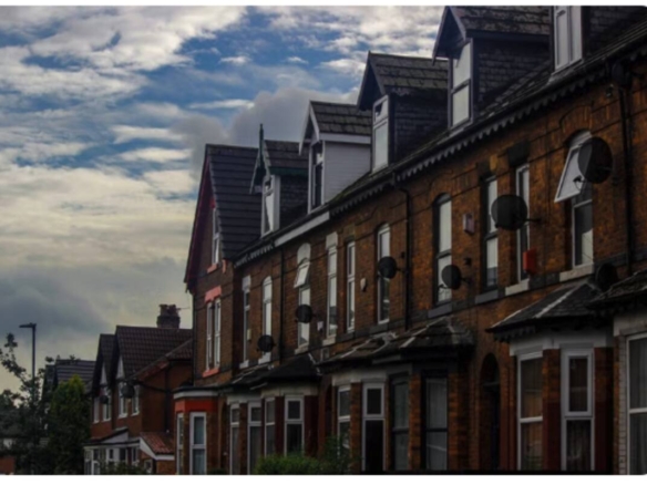 Row of Victorian brick terraced houses in a UK residential street