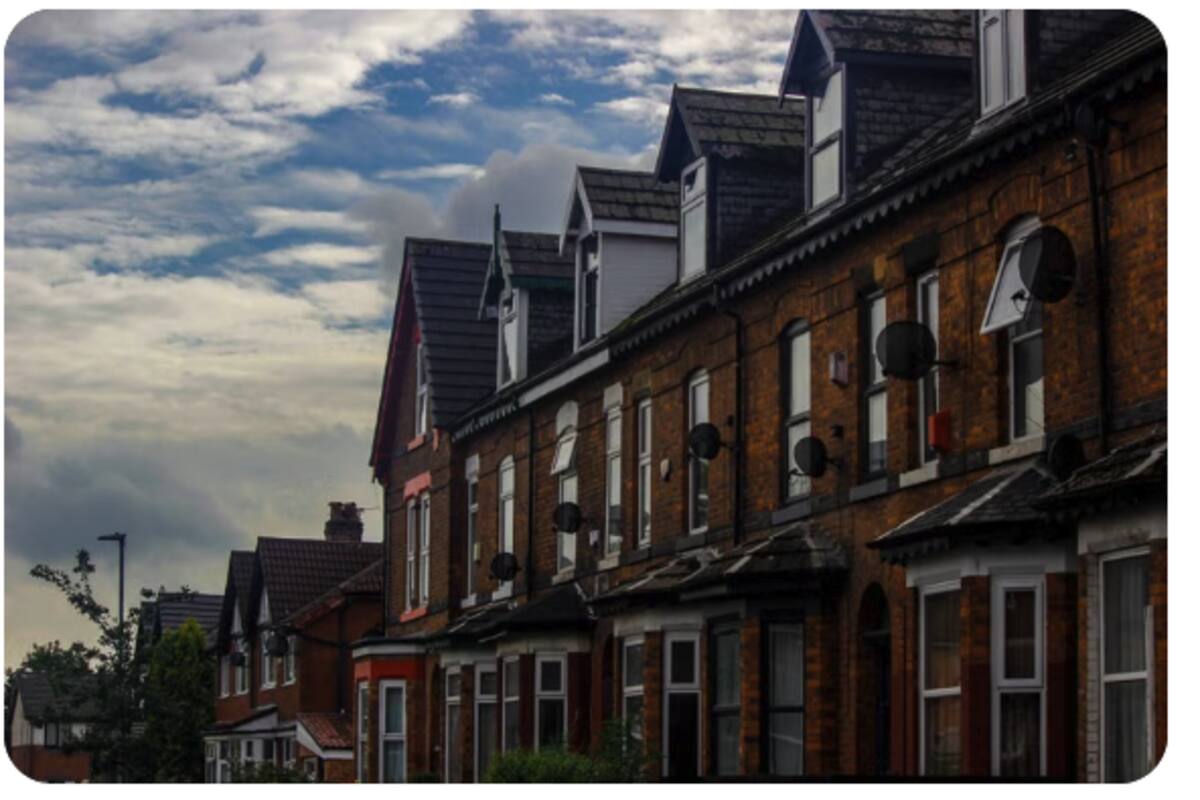 Row of Victorian brick terraced houses in a UK residential street