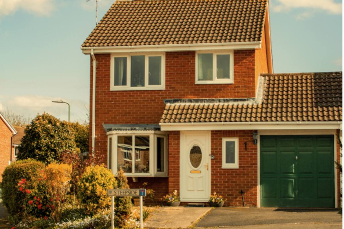 Charming British suburban detached home in warm sunlight
